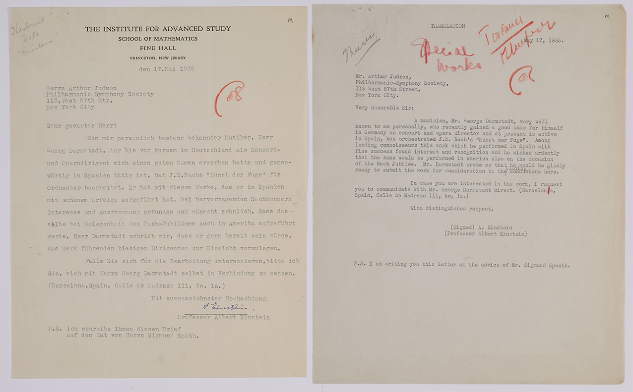 A letter in German signed by Albert Einstein. On the right is a translation.
