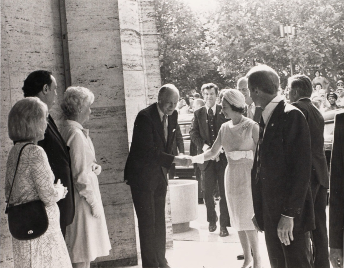 Photo of Queen Elizabeth II with Philharmonic Chair Amyas Ames outside Philharmonic Hall.