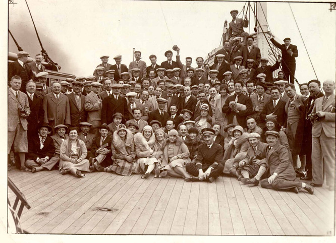 Photo of New York Philharmonic musicians, significant others, and guests aboard the SS De Grasse departing for their first stop in the tour, Paris.