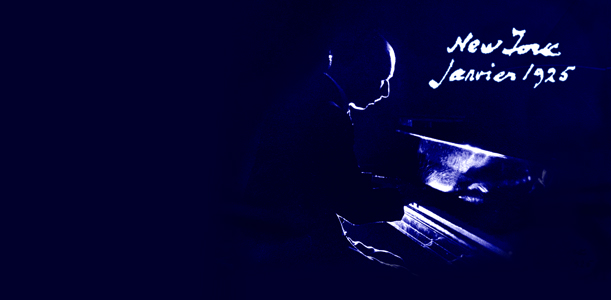 Igor Stravinsky seated at a piano in dramatic silhouette